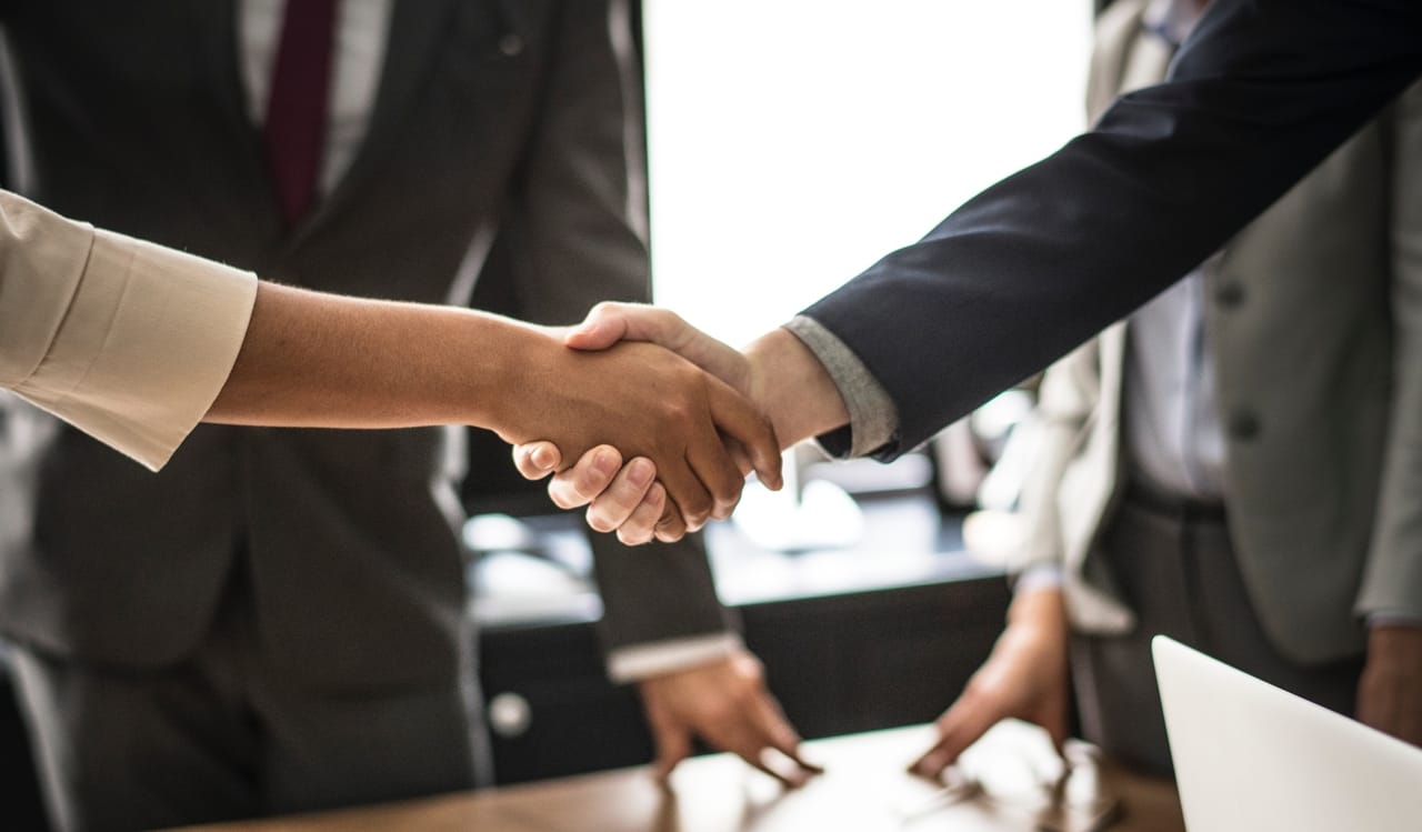 two-people-shaking-hands