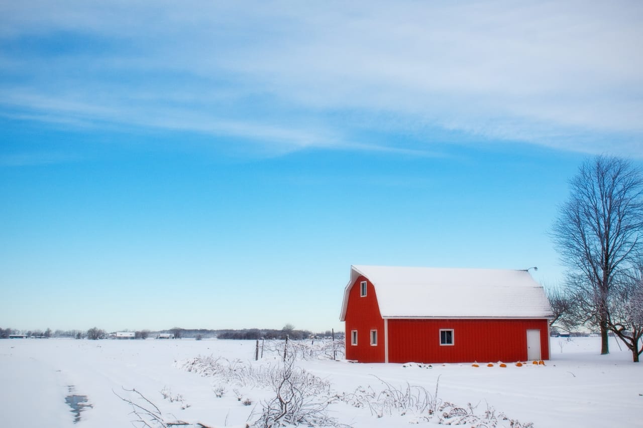 red-barn-in-snowy-field